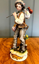 Capodimonte signed porcelain figure of a young boy holding a Stick