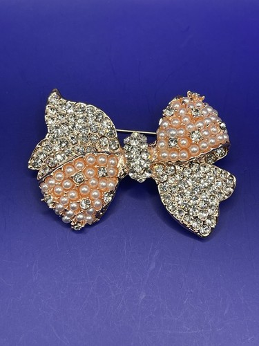 Rose gold tone bow - gold,