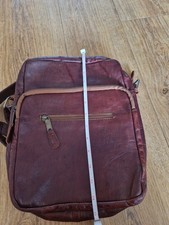 Gorgeous Oxblood Leather Bag with Suede interior. Numerous Zip Pockets.