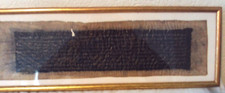 ANCIENT SCRIPT ON PARCHMENT IN GLAZED FRAME 19" X 5"
