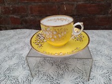 Antique English porcelain Yellow ground gilt & white floral cup & saucer