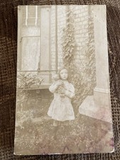 Early 20th c. RPPC Girl w/ Toy
