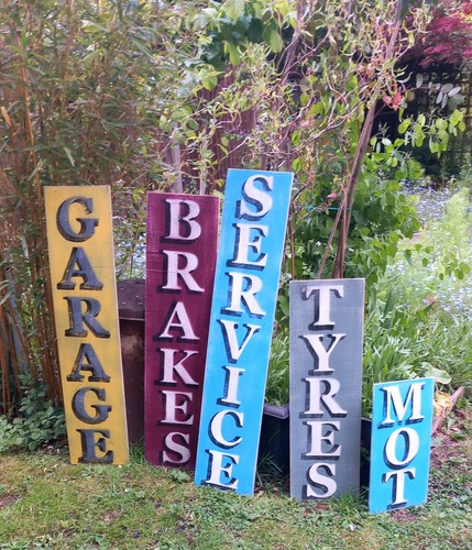 Rustic painted garage tyres - garage,