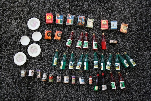 Old dolls house - bottles, tins