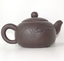 A Japanese Yixing pottery teapot.