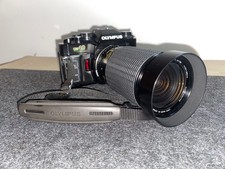 Olympus OM-40 35mm SLR + Sigma