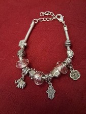 Lovely Charm Bracelet In Silver Tone. 3 Pink Spacer Beads And 3 Dangle Charms.