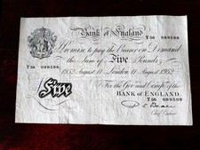 Five pound white banknote - five,