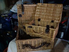 Two vintage wicker picnic baskets with leather straps