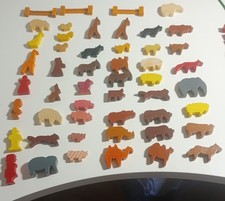 Vintage wooden model village houses, buildings, trees animals and vehicles.