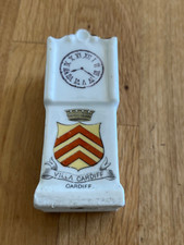 crested grandfather clock -