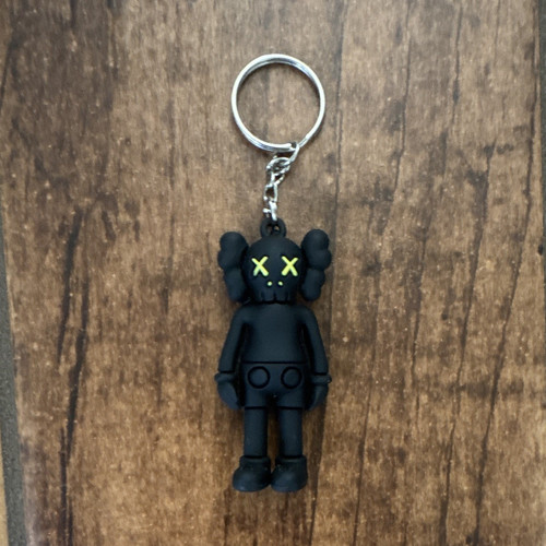 Kaws black yellow character - &,
