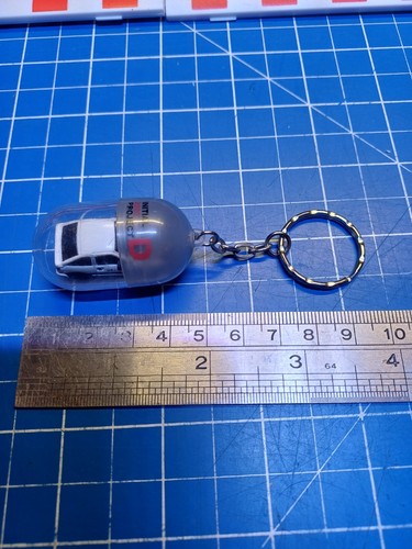 Initial keyring capsule - initial, d
