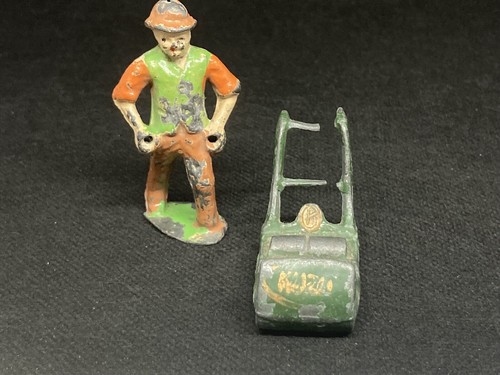 Gardener with lawn - mower, by
