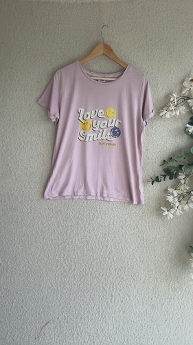 Next pink smiley world slogan - next,