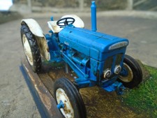 Weathered Fordson Super Dexta 1/32 scale model tractor diorama in display case