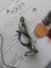 bronze-colored mermaid