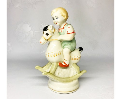 Porcelain figurine boy a - boy, on