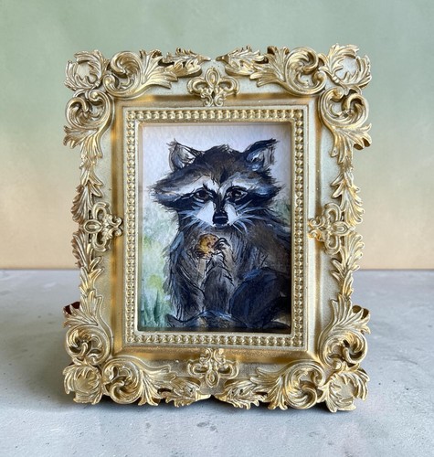 Raccoon holding cookie - holding,