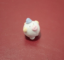 tiny ceramic ornamental piggy