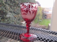 Antique drinking glass ruby flashed & cut with forest scene .