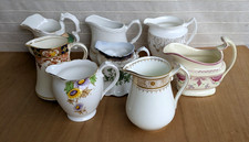 Antique vintage milk jugs