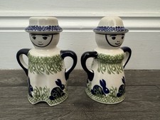 Salt and pepper shakers - and,