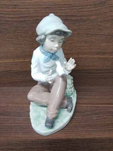 Nao lladro boy with - boy,