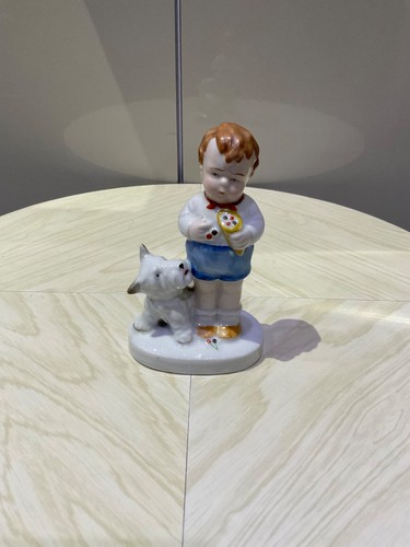 Figurine child and dog - and,