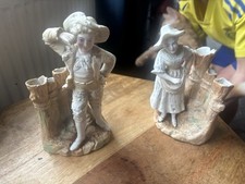 pair of antique bisque spill