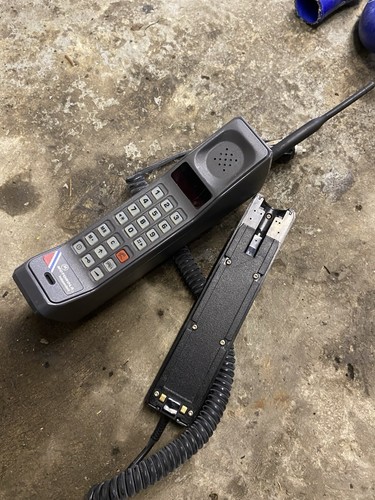 Motorola brick phone and car - and,