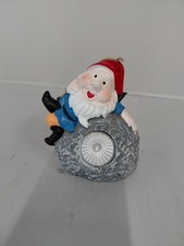 solar pannel light cement Gnome on a rock