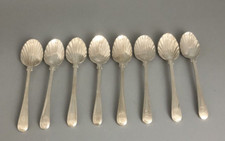 Eight Matched Crested SIlver