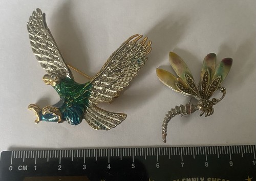Two colourful brooches one - colourful,