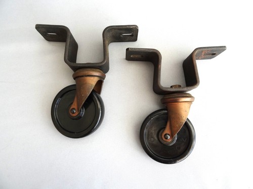 Pair vintage castors - of, by