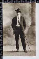 OLD POSTCARD STUDIO PHOTO MAN WALKING CANE TRILBY HAT PAISLEY TIE