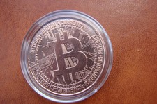 1oz .999 Fine Copper Bitcoin round, in capsule.