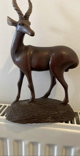 Hand carved wooden antelope - hand,