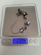 Rhonda Sutton Sterling Silver Charm Bracelet with 8 Charms.