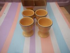 VINTAGE SET OF 4 YELLOW CERAMIC EGG CUPS NEW OLD STOCK