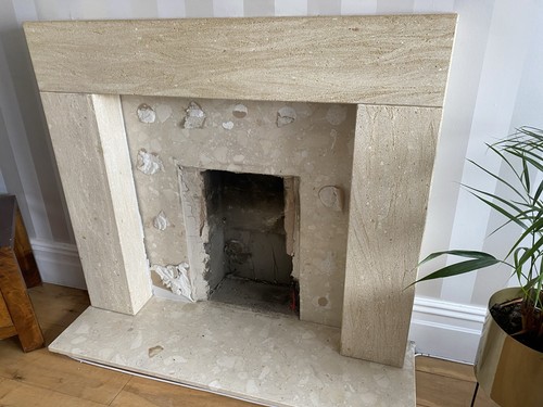 Beige stone fireplace surround - stone,