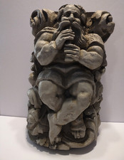 Titan playing flute gargoyle - titan,