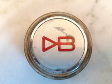 An original vintage Aston Martin DBS steering wheel centre badge