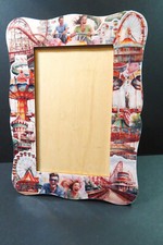 WOODEN PICTURE FRAME WITH A COLLAGE DESIGN OF FUN FAIR RIDES   (P500)