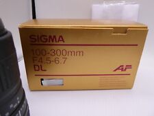boxed Sigma 100-300mm f/4.5-6.7 DL Zoom Lens in Sony A / Minolta AF Mount 5 pin