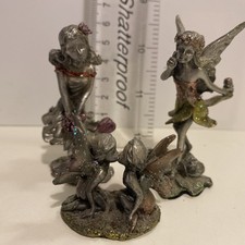 Three  Pewter Fairies.