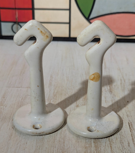 Pair vtg cast iron - pair, white