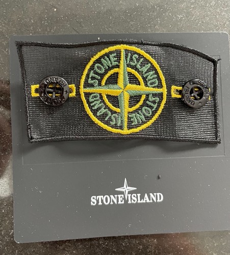 The stone island badge with - badge,