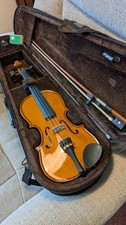 1/8 Size Stentor violin with case bow and rosin. Excellent condition throughout.