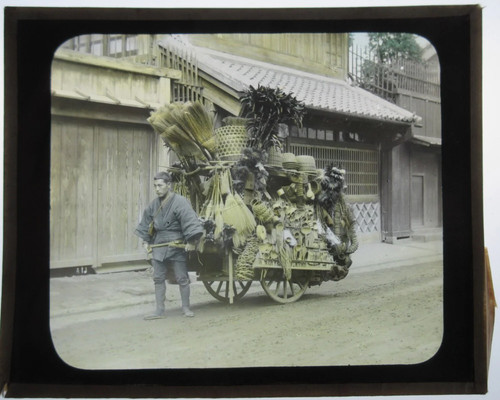 Man pulling vending cart - man,